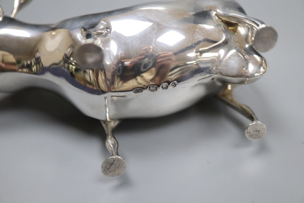 A mid 20th century Dutch white metal cow creamer, length 14cm, gross 145 grams.
